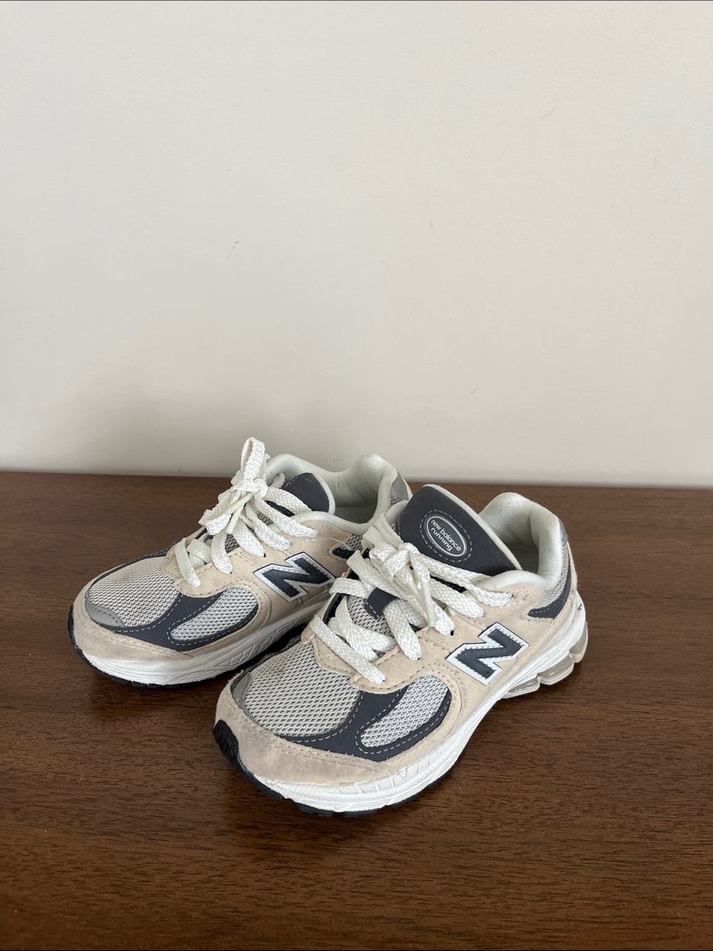 New Balance Kids Cream and Gray Sneakers